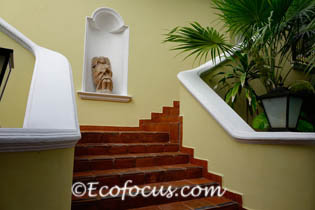 Stairway and statue of angel in alcove